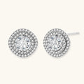 Double halo sterling silver stud earrings with brilliant round moissanite center stones and pavé crystal accents