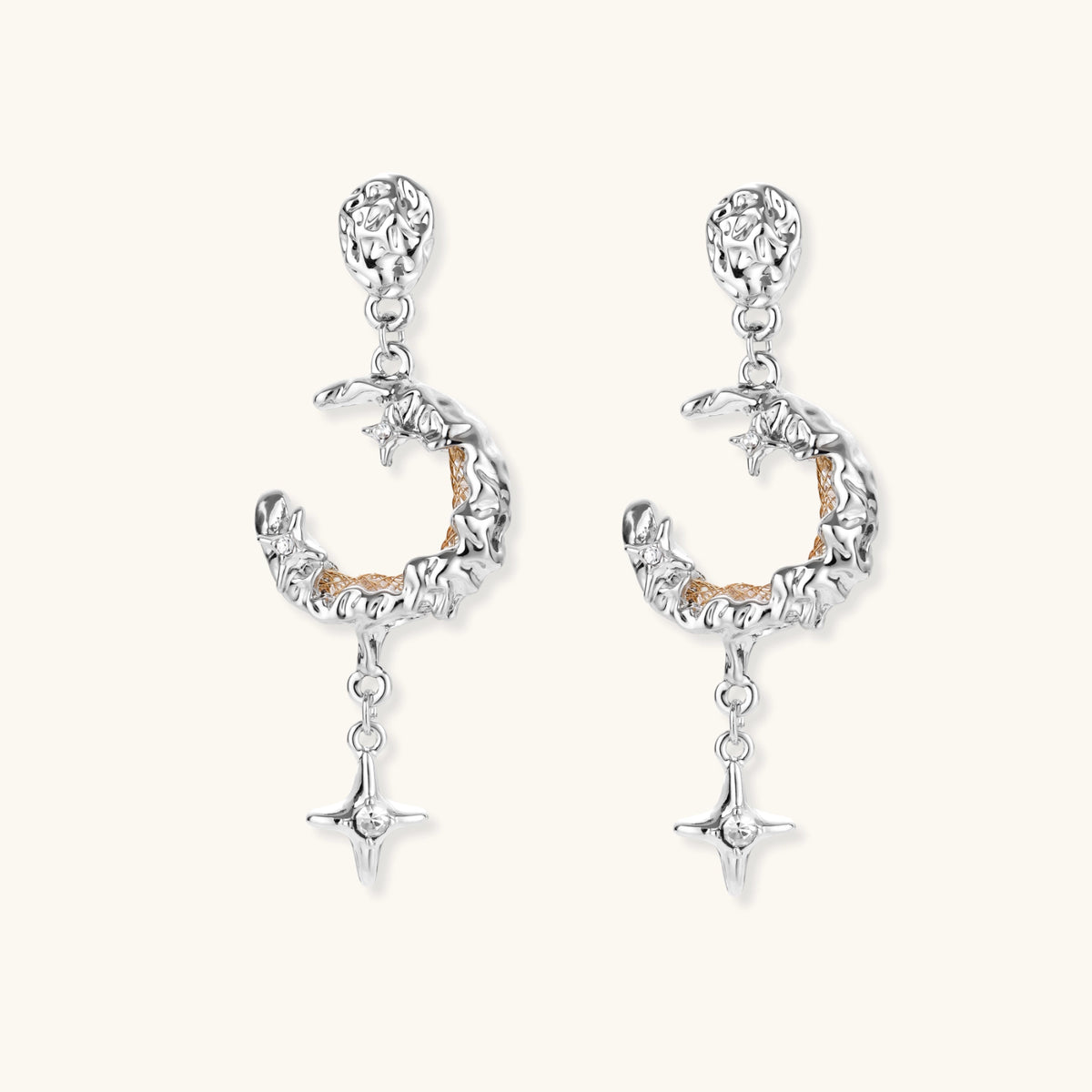 Detailed eco-brass dangle earrings featuring crescent moons with gold rope details and dangling star charms on white background.