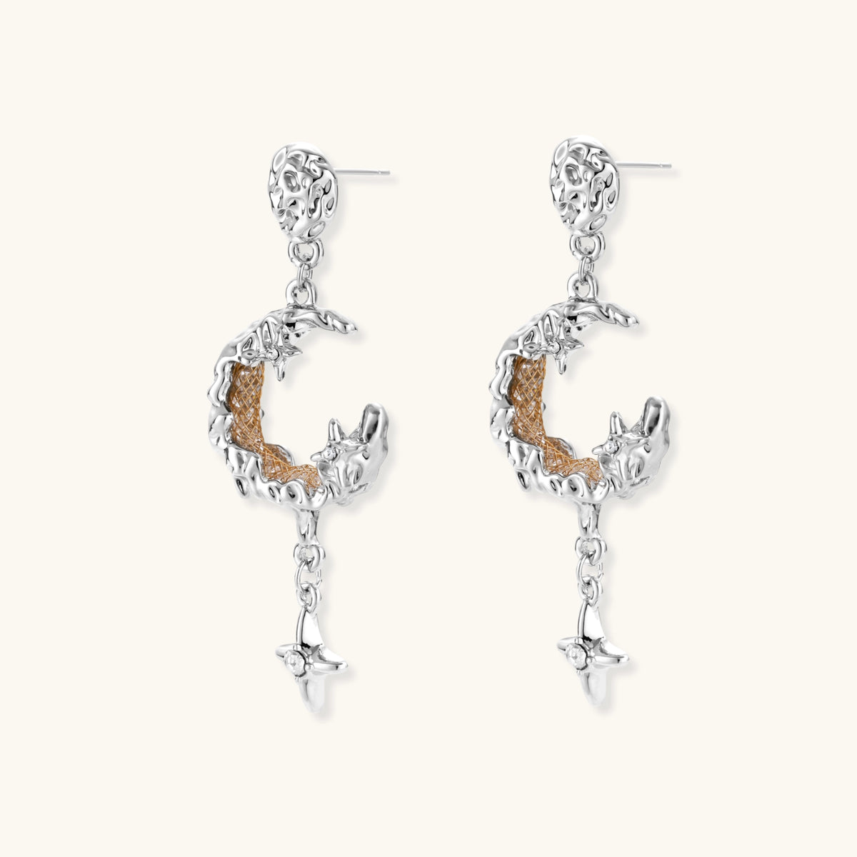 Detailed eco-brass dangle earrings featuring crescent moons with gold rope details and dangling star charms on white background.